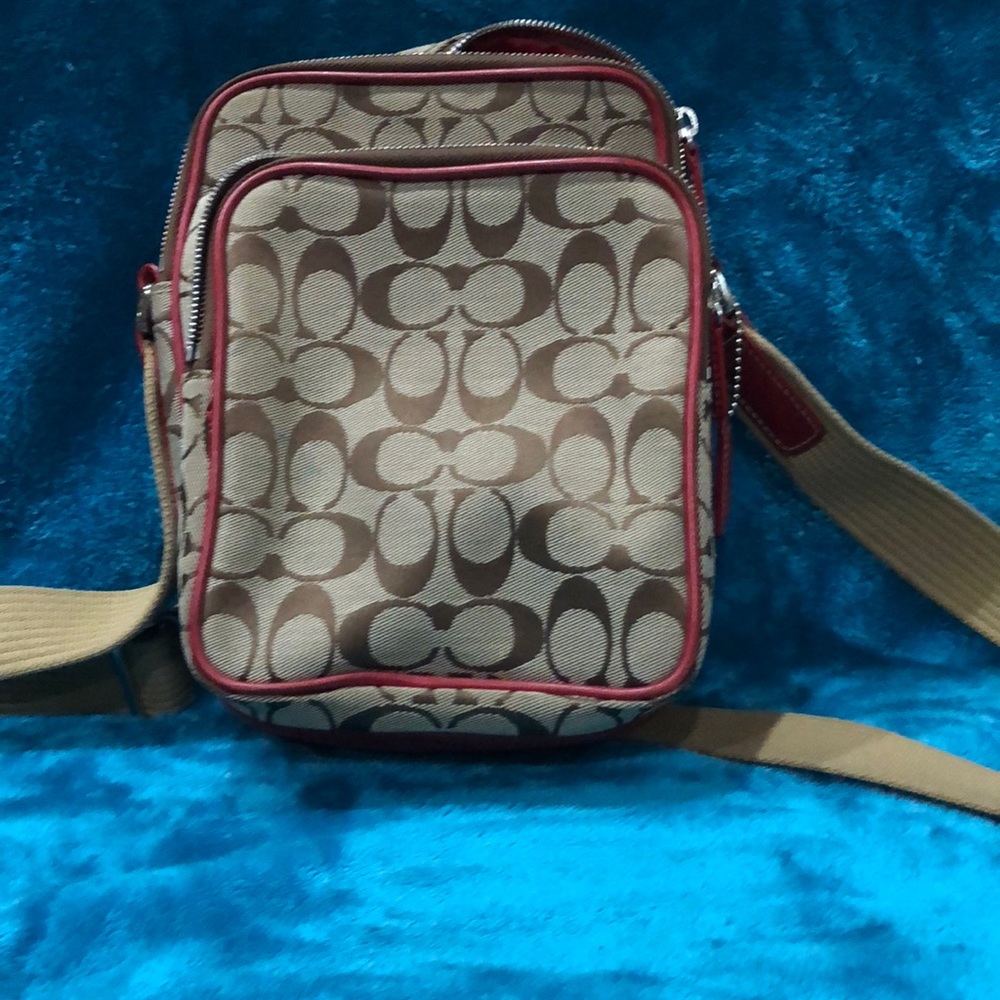 Brown and tan and red crossbody coach bag
